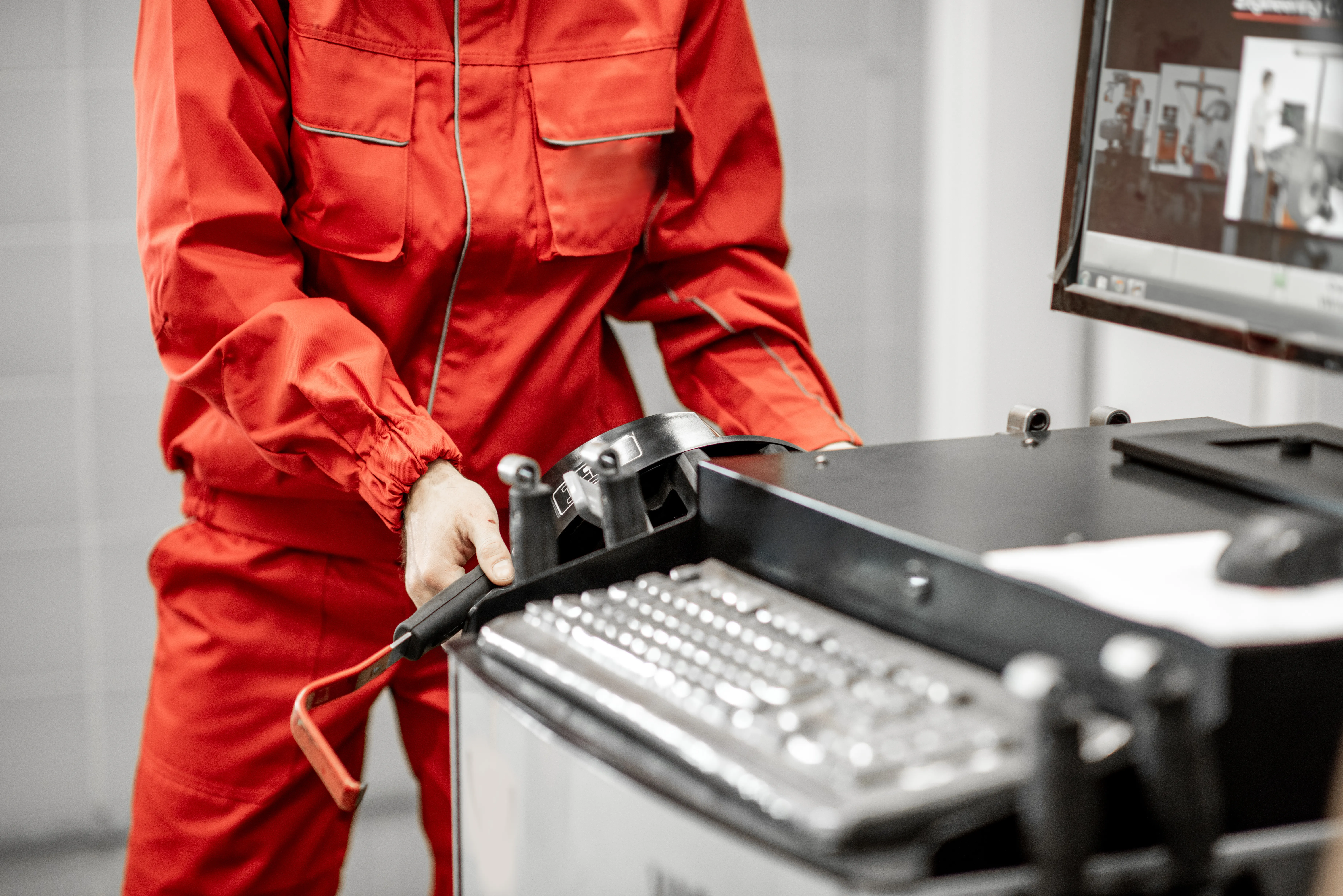 gloved hand holding test tube by river