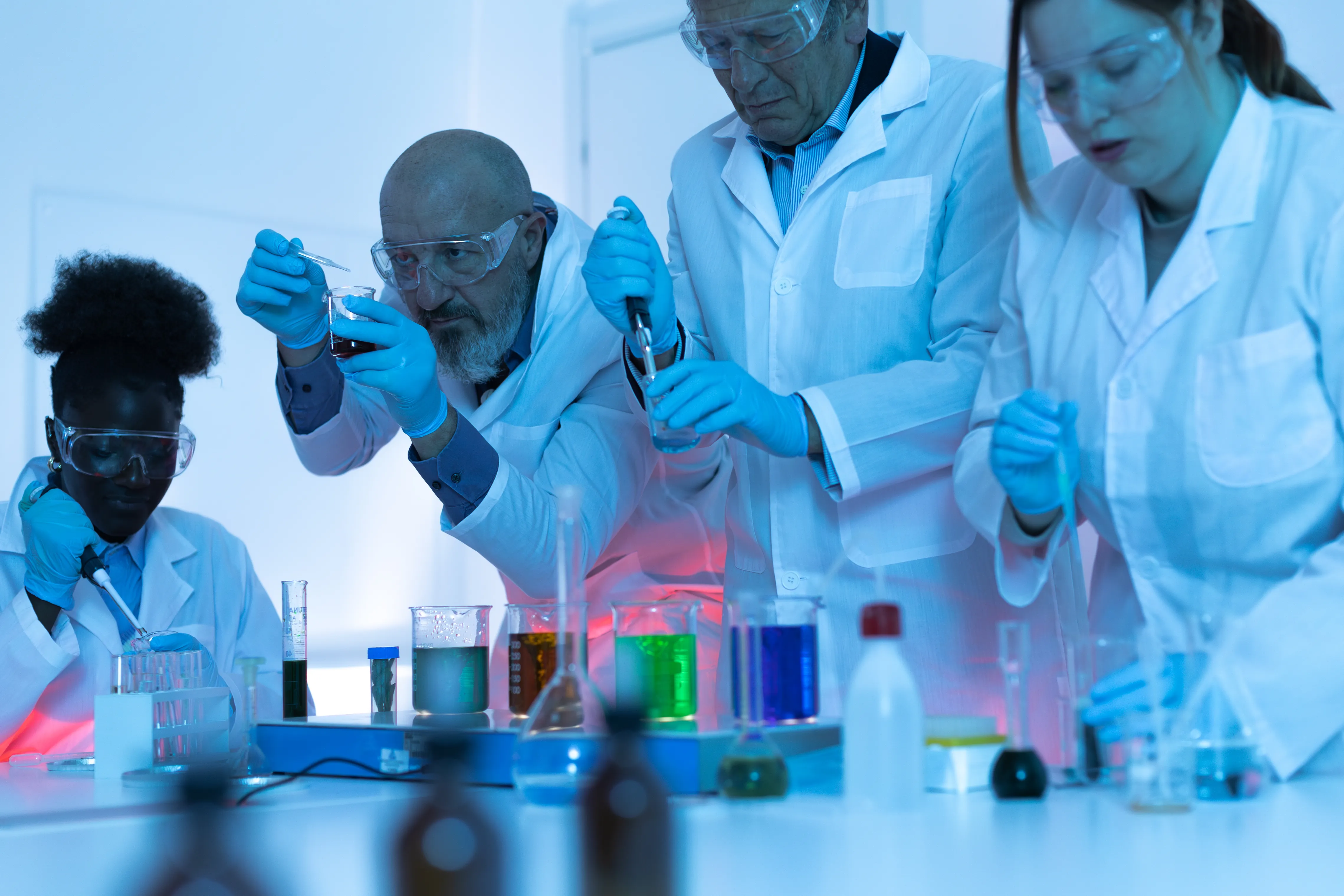 scientist pouring water into beaker