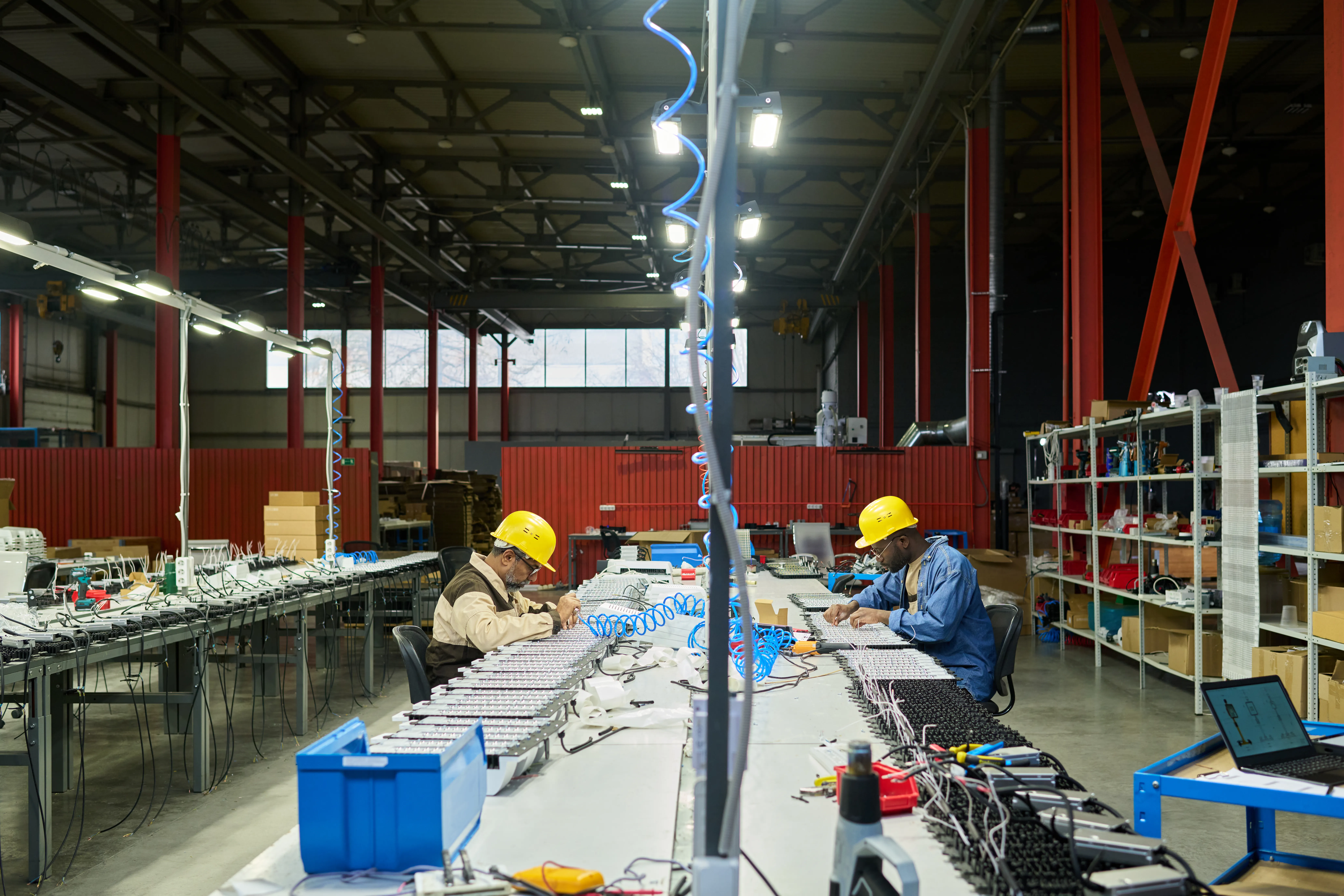 gloved hand holding test tube by river